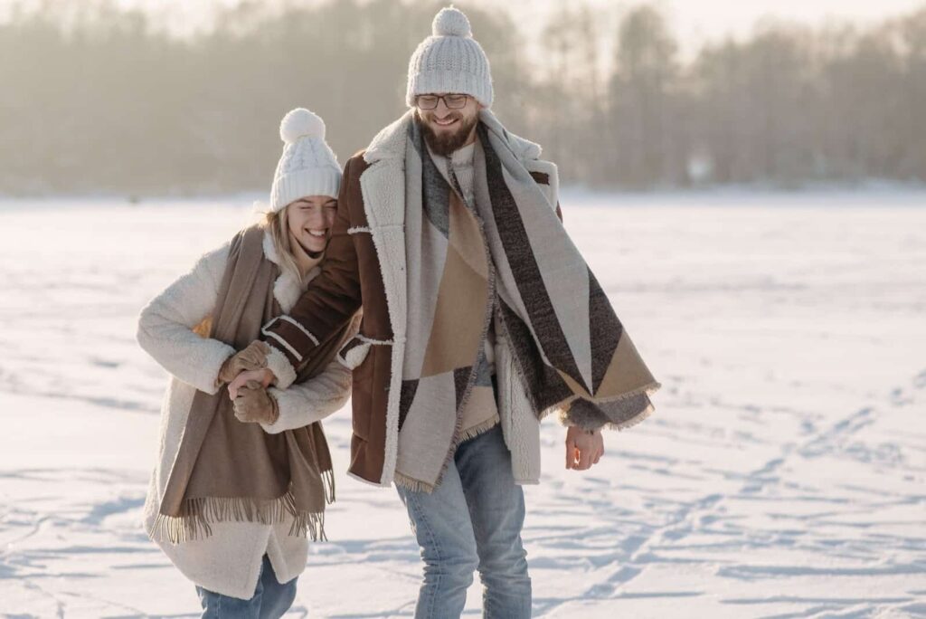 Couple wearing winter clothing on a date in the park